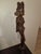 An extraordinary, gallery-scale mid-century Balinese modernist realism sculpture depicting a temple maiden carrying a...