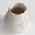 With a reactive glaze and hand finished ribbing detail, this charming vase is a great find. Add a few faux stems or...