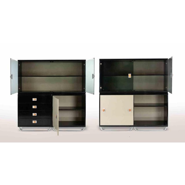 Modular sideboard by Guido Faleschini for I4Mariani in 1970s. Black and beige lacquered wood with chrome details and...