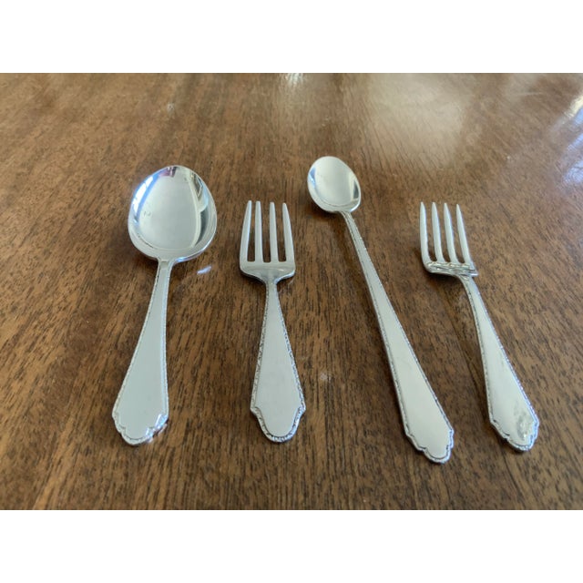 Terrific baby gift. Four piece set of Lunt Sterling Silver: infant spoon(5.5”l) porridge spoon (4”) and two forks (4” &...