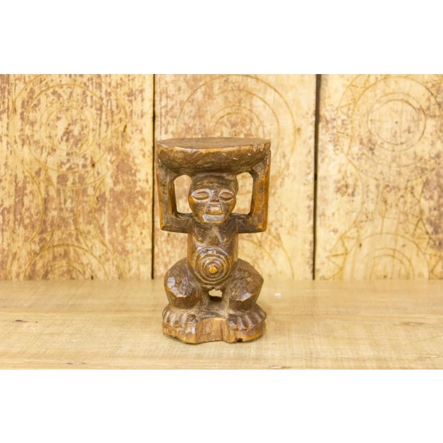 A small African Songye carved statue which were originally used as part of ritual ceremonies. This gorgeous statue is...