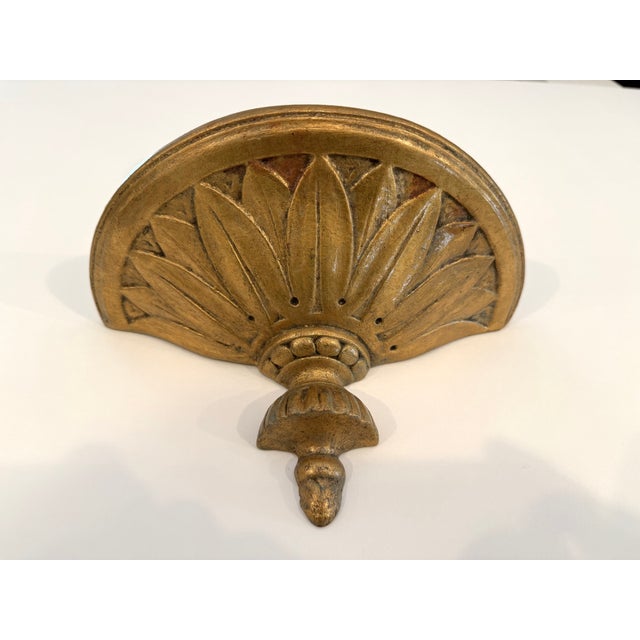 For a living room, library or bedroom, a charming single wall bracket in gilt plaster. in the Neo-Classical style. This...