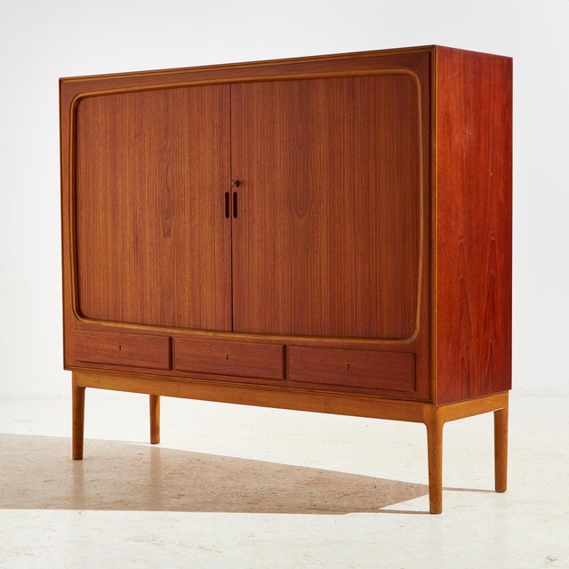 Teak and beech highboard from the 1960s, Denmark. This teak beauty has plenty of storage space with two sliding doors and...