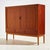 Teak and beech highboard from the 1960s, Denmark. This teak beauty has plenty of storage space with two sliding doors and...