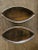 Sleek pair of hand carved wooden, boat shaped bowls. Sticker on the bottom says Haiti. Rustic yet modern style. The bowls...
