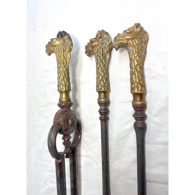Up for sale is a set of 3 antique 19th century brass and steel figural dragon fireplace tools. The handles are made of...