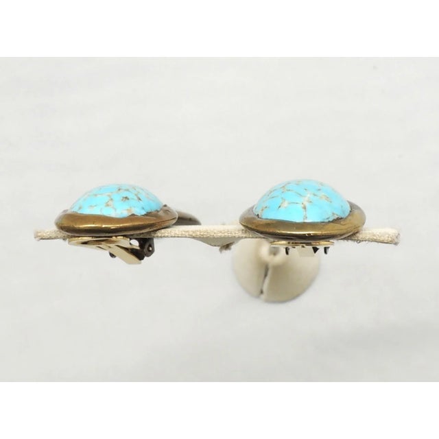 This is part of Chairish’s Costume Jewelry assortment. 1980s copper? plated cabochon faux-turquoise and unfoiled faceted...