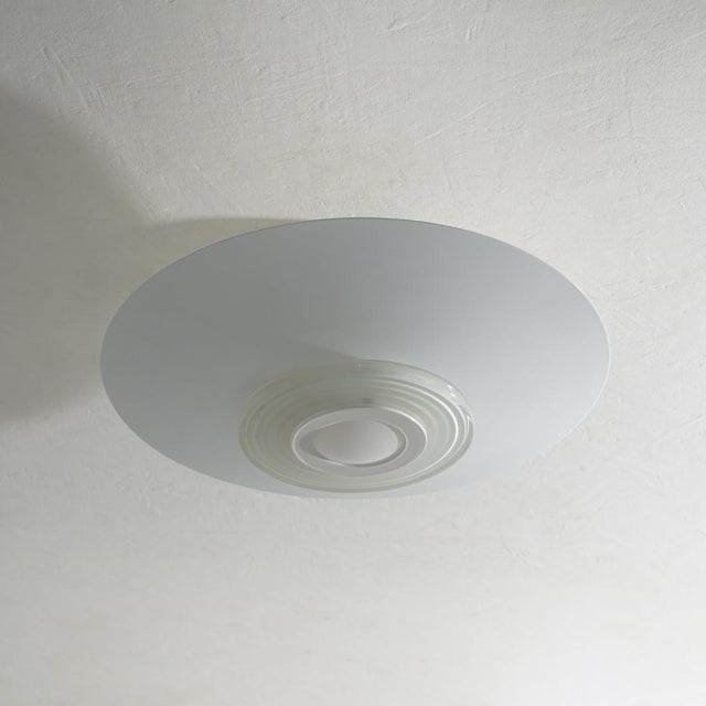 Designed by achille castiglioni for flos in 1982, the moni lamp combines technical precision with visual harmony. made of...