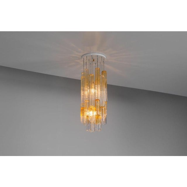 This stunning and rare pair of large venini glass chandeliers, designed by ludovico diaz de santilla crafted in murano,...