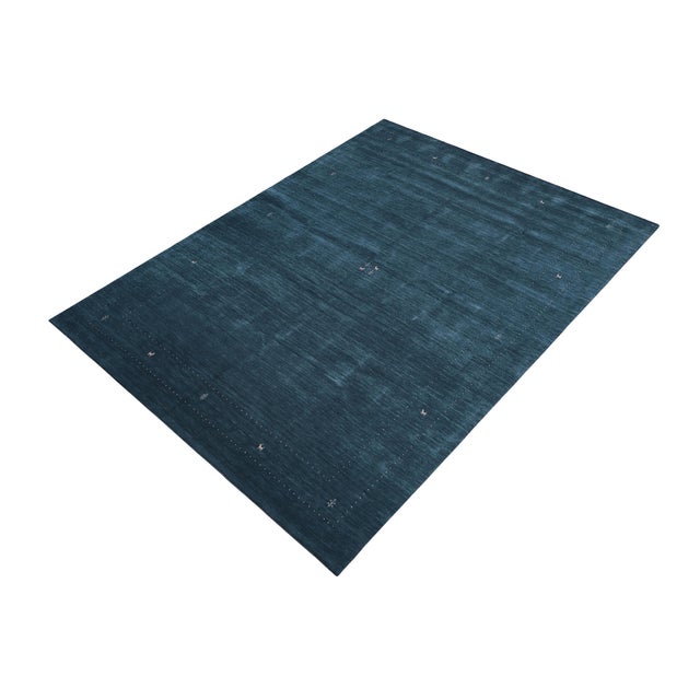 Make a bold statement in your living area with this exquisite contemporary Gabbeh wool rug. It is meticulously hand-...