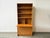 A Mid-century modern Danish teak wall unit designed and manufactured by Sejling Skabe in the 1960s. This modular mid-...