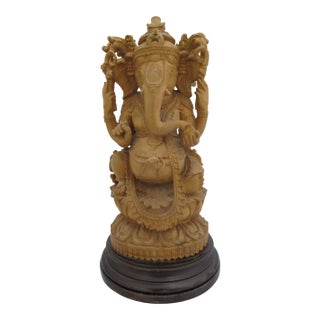 Seated Lord Ganesha Holding Fruit Carved Wood Hindu Deity God Statue on Pedestal For Sale