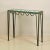 Pair of chic verdigris 'Meandre' and glass consoles by Design Frères.