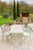 Betel is an outdoor dining table with a travertine top and metal frame, made in Italy and designed for convivial outdoor...
