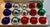 Fifteen (15) Mercury Glass Ornaments by Rauch. Three (3) ornaments are stenciled with silver designs on green and red...