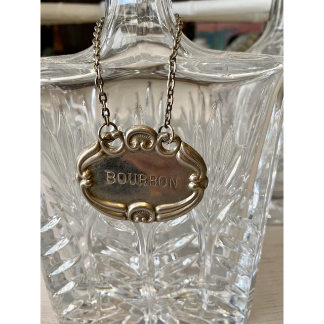 Collection of three exquisite shape and design faceted Crystal liquor decanters. Large measures 14”H; medium 13” H; small...