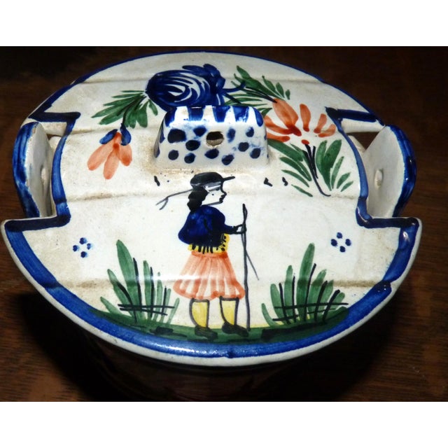 A charming and authentic example of early 20th-century French faience from the HB (Hubaudière-Bousquet) factory in...