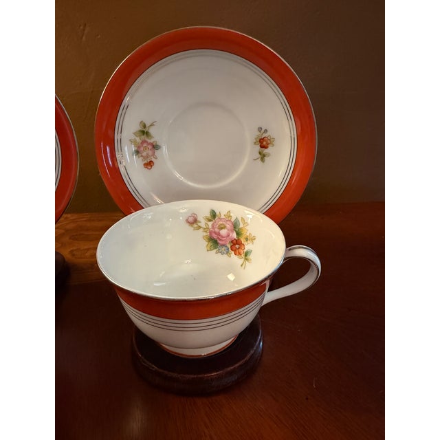 This Vintage Noritake M China Tea Cups, Saucers and Wooden Stands Set of 4 is a charming and delicate addition to any tea...