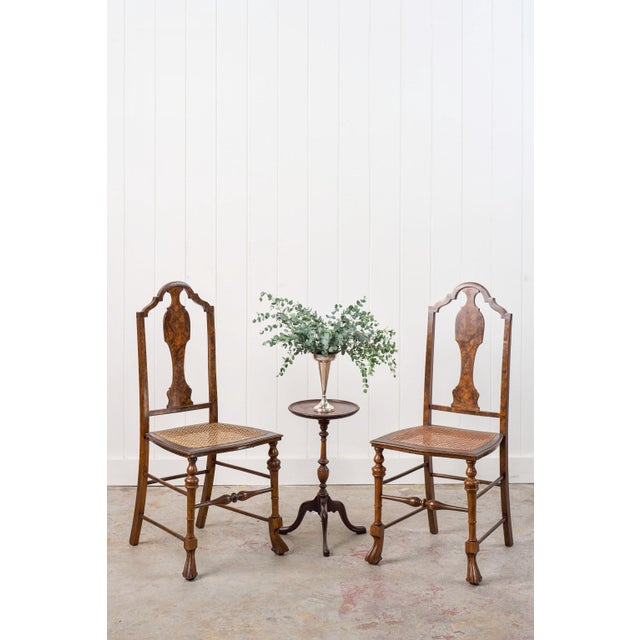 This pair of 19th-century burl walnut chairs features high backs that are framed with crest rails and an inset burl walnut...