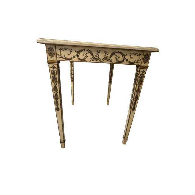 French painted end table with ivory background and black and gilt classical decorations. Beautiful detail to the top and...