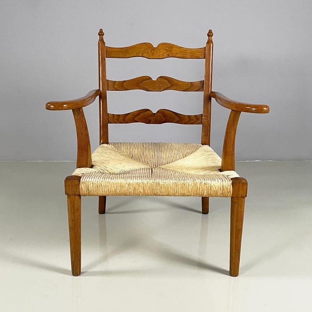 Italian mid-century modern Armchairs in woven straw and wood, 1940s Pair of armchairs with square woven straw seat. The...