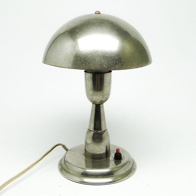 Table lamp designed by Apolinary Gałecki, produced in Poland in the 60s. It was made of metal. It is preserved in good...
