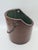 A decorative wooden hanging basket with a distinctive cylindrical shape, made of many carefully fitted wooden staves. The...