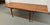 Beautiful mid-century Danish teak draw-leaf dining table by Uldum Møbelfabrik, showcasing the elegant simplicity and...