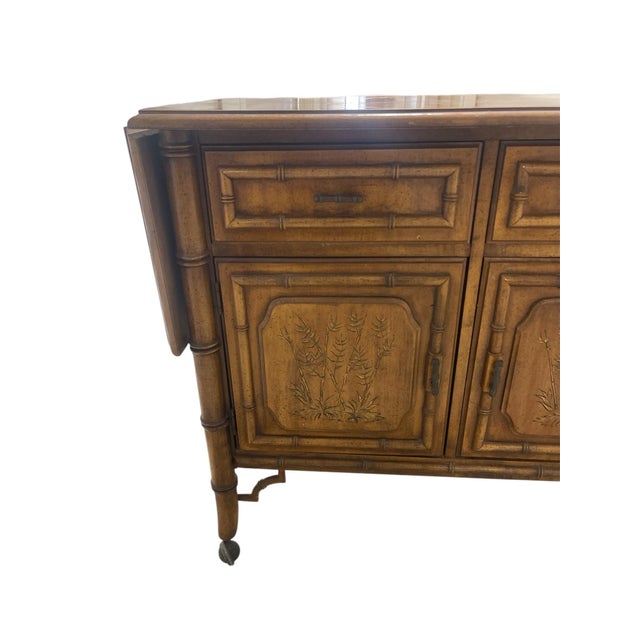 Part of the Dixie Furniture Company's Aloha collection, it is known for its Chinoiserie/Palm Beach Chic, faux-bamboo, or...