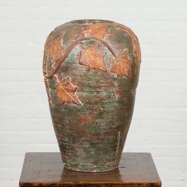 A vintage Thai garden vase from the mid-20th century, with leaf motifs. Created in Thailand during the midcentury period,...
