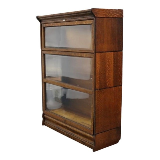 This is an antique Lundstrom Arts & Crafts barrister bookcase, crafted from oak and featuring a three-stack design. The...