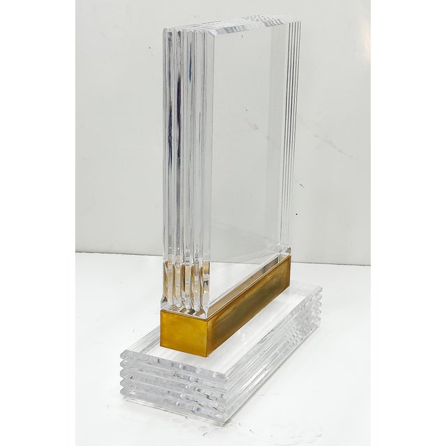 Substantial Lucite and Brass Dining Table, Etched Glass Top Offered for sale is an impressive and very substantial dining...