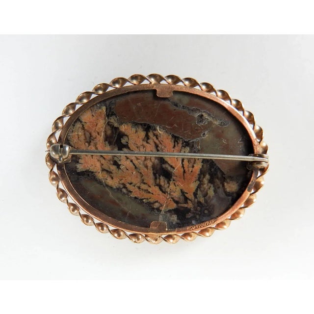 Vintage mid 20th century artist studio made oval plume agate stone in gold fill twist bezel setting. Setting marked GF on...