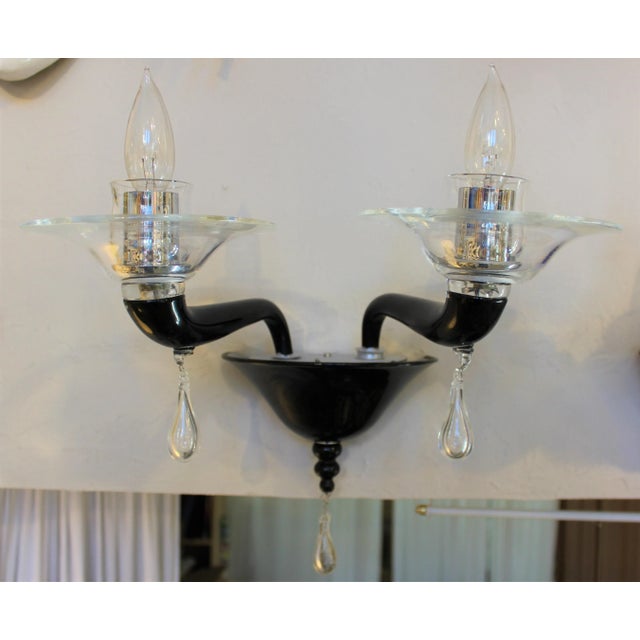 This strikingly beautiful wall sconce called "Black Scarlatti was hand made by the Glass Masters of Venini, in Murano,...
