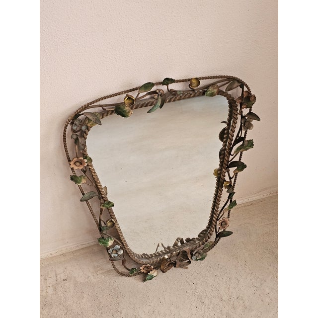 Italian Floral Wrought Iron Mirror, 1950s Elegant Italian wall mirror dating from the 1950s, featuring a beautifully...