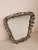 Italian Floral Wrought Iron Mirror, 1950s Elegant Italian wall mirror dating from the 1950s, featuring a beautifully...
