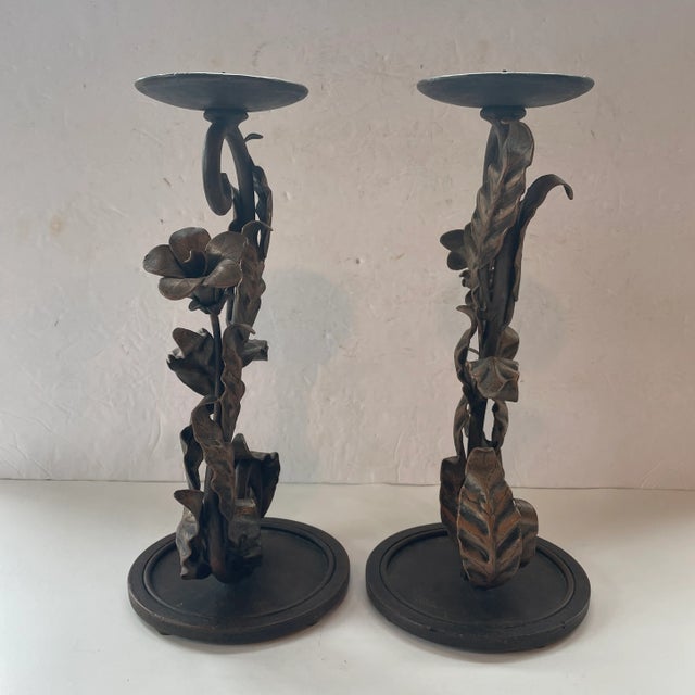 A stunning pair of tall candle holders for pillar candles. These 12" high beauties are hand wrought iron with a scroll...