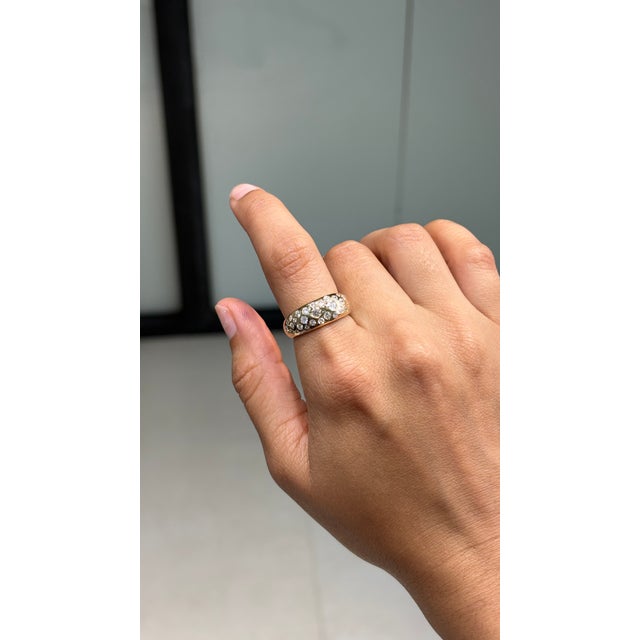 This bombe ring showcases 0.81 carats of natural diamonds, set in 14K solid yellow gold. All mixed sizes diamonds creating...