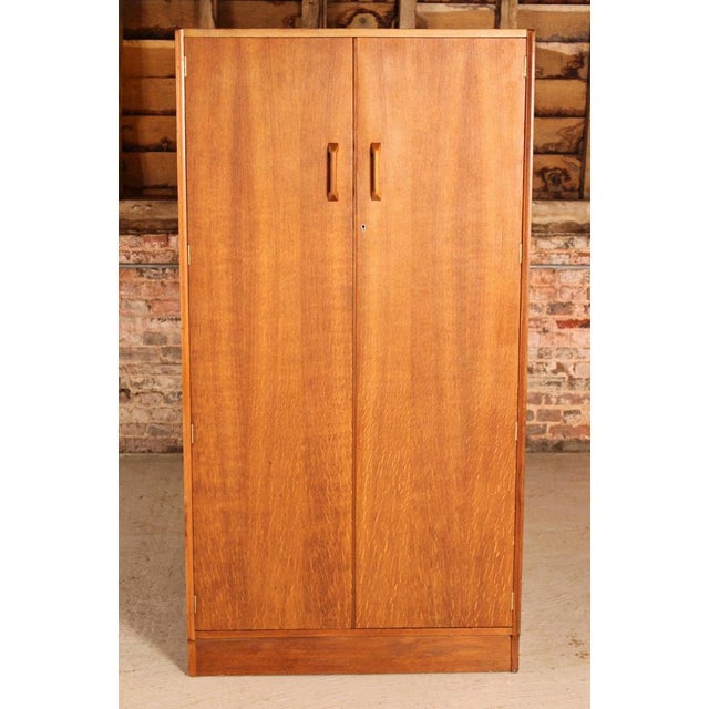 Mid Century G-plan Brandon range oak double wardrobe, circa 1960s. 2 drawers and clothing rails inside. Excellent fully...