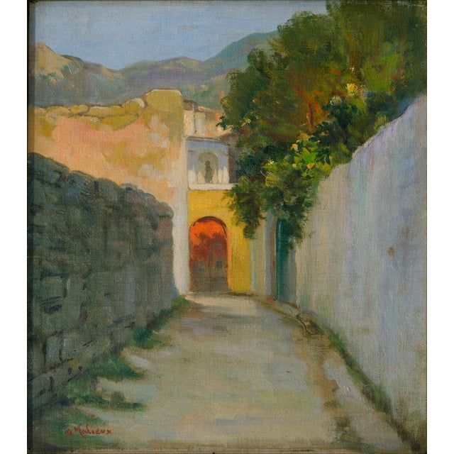 A charming sunlit alley in Ischia painted by Alfredo Mahieux in 1949, where a quiet Mediterranean street leads the...