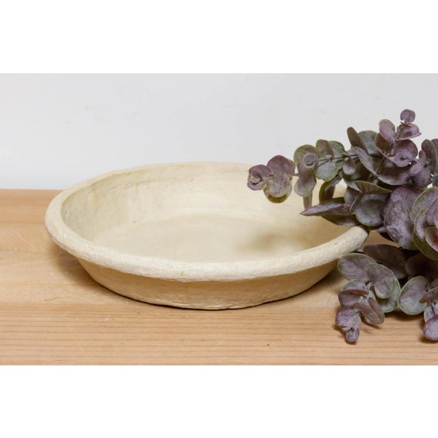 A lovely handmade from papier-mache for a touch of rustic charm, this handcrafted aged white round plate boasts surprising...