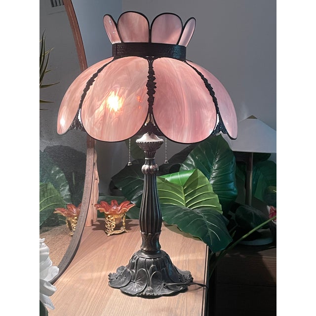 This 1970's lamp features a stunning, hand-curved pink marbled art glass shade formed into delicate lotus/tulip petals...