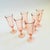 A set of 6 vintage champagne flutes in a pale blush pink hue. Each glass has a lovely swirl design. Made in France by...