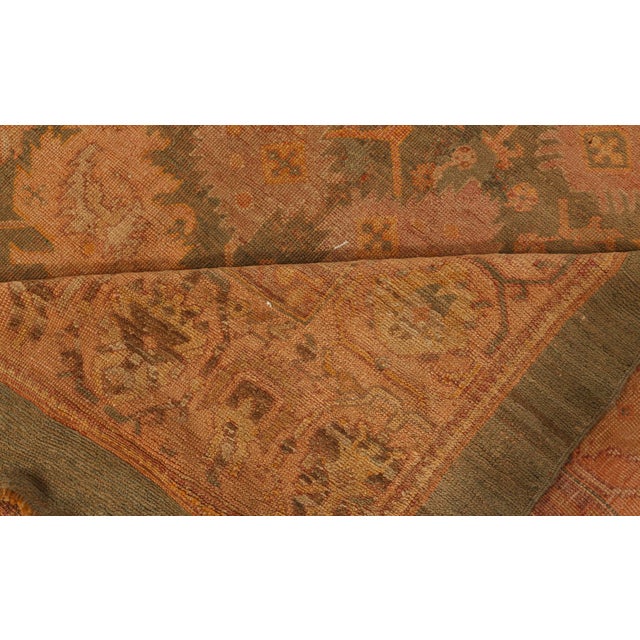 This magnificent antique Oushak rug, woven in the early 20th century in Western Anatolia, embodies the poetic elegance of...