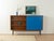 Wonderful sideboard from the 1960s. Teak veneer body with a sliding door, four shelves, and new black square steel legs....