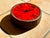 An impressive ceramic art wall clock in brutalist style with a rough charm and fat lava glaze in hues of orange-red. It...