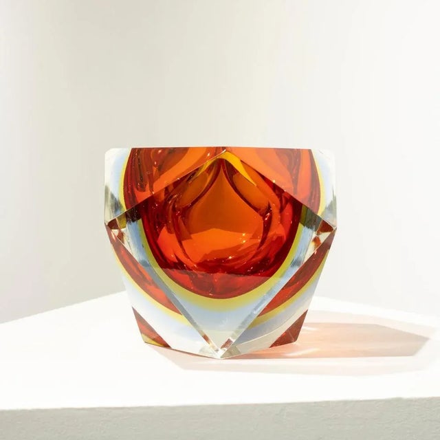 Italian small vase designed by Flavio Poli in the 1970´s. The vase is hand-crafted in faceted Murano glass with a...