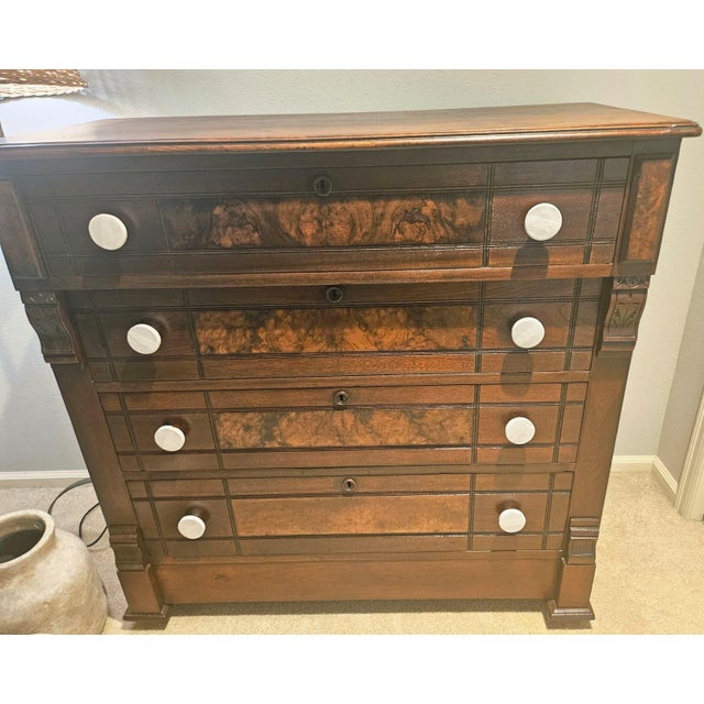 Stunning statement piece is in excellent structural condition, featuring a Solid walnut body with gorgeous burled walnut...