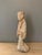 Terracotta sculpture of a court lady, Han Dynasty (206 BC-220 AD). Polychrome painted terracotta. Depicts a lady in an...