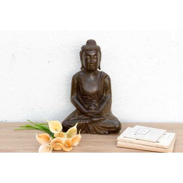 Introduce a profound sense of peace and spiritual artistry to your space with this magnificent hand-carved stone Buddha....